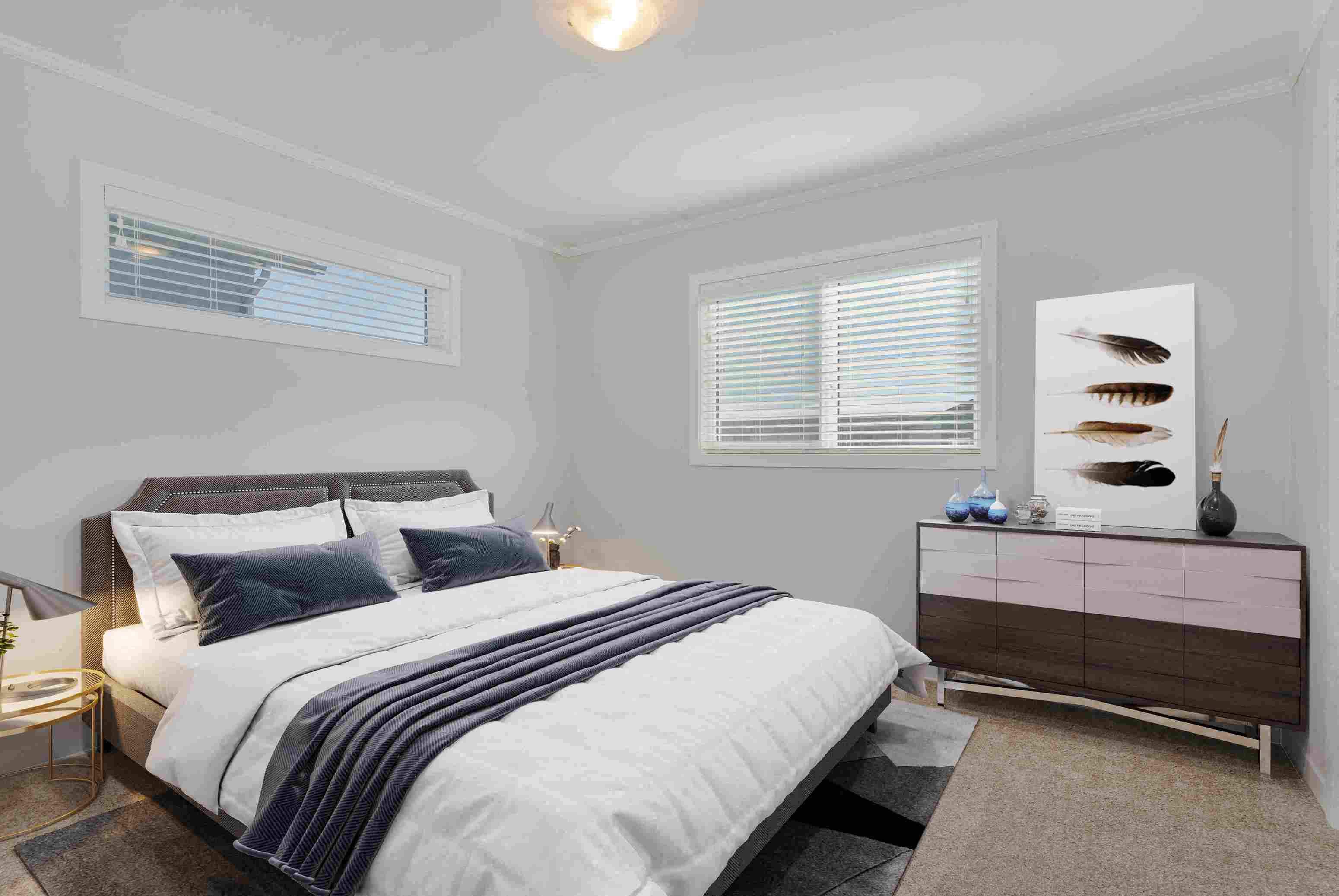 a bedroom with a bed and a dresser