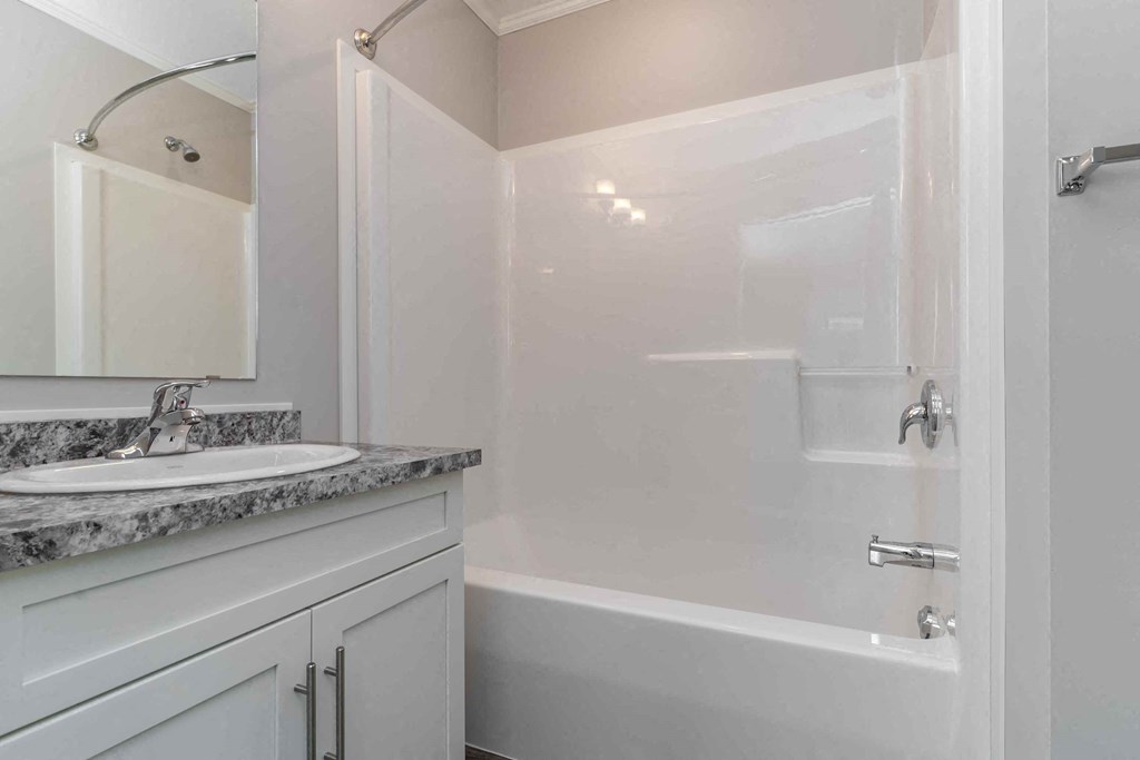 a bathroom with a sink and a bath tub