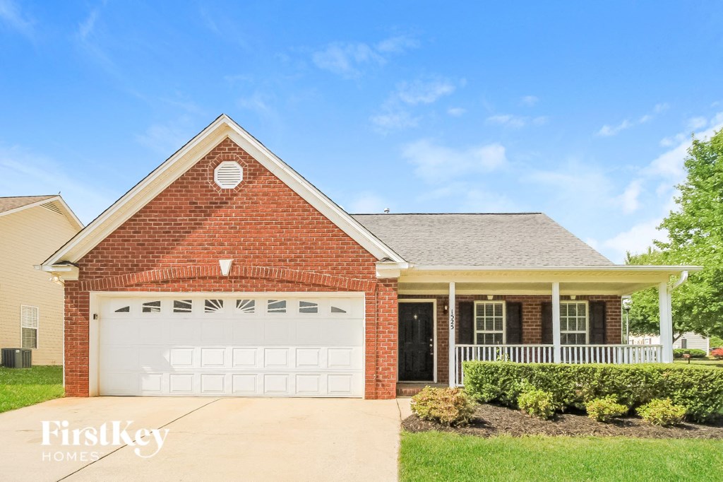 a brick house with a white garage door