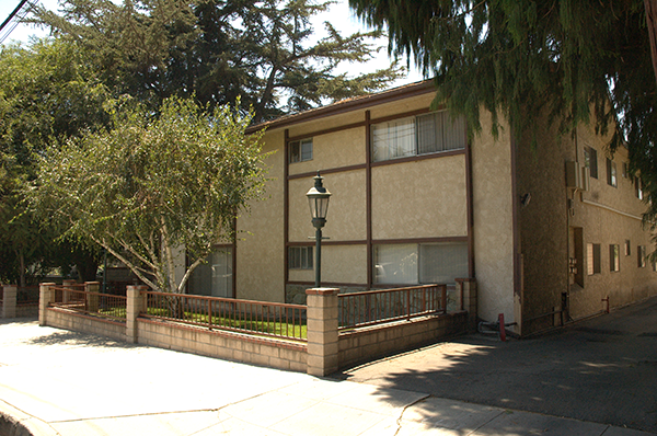 a building with a fence in front of it