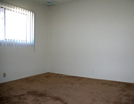 an empty room with a window in it