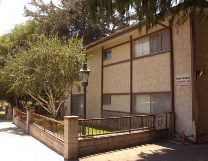 a building with a fence in front of it