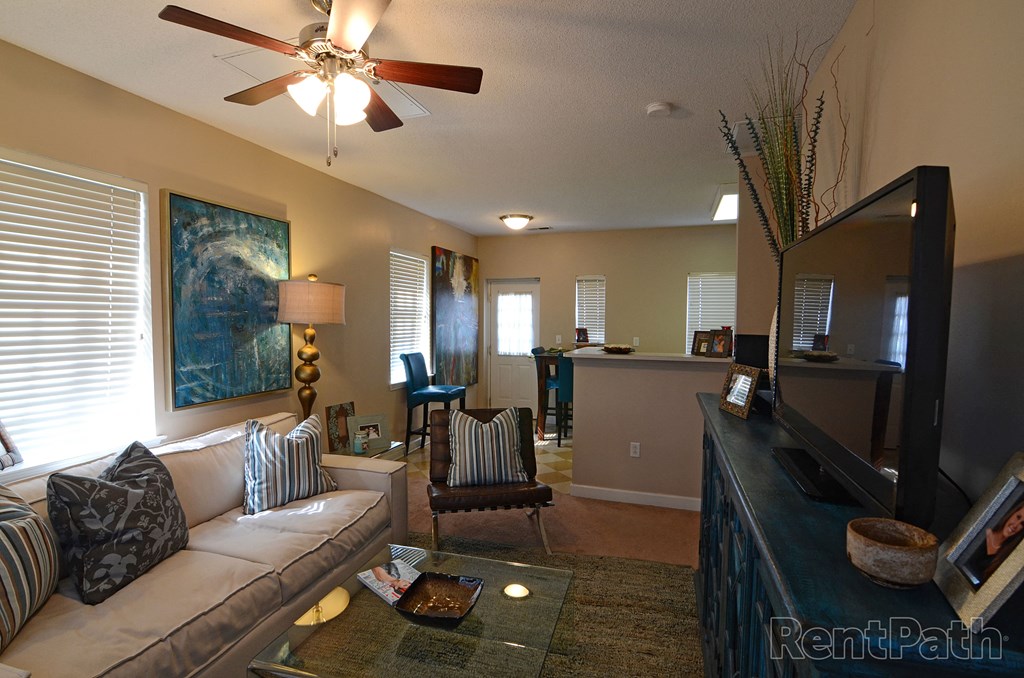 a living room with a couch and a tv