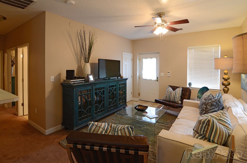 a living room with a couch and a tv