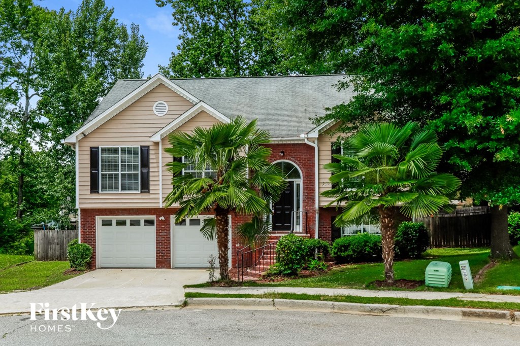 A house with a garage is for sale.