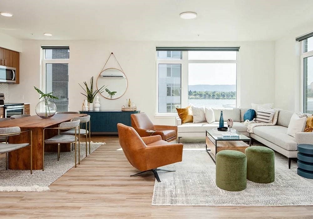 Living room with large windows and arranged furniture in two bedroom two bathroom