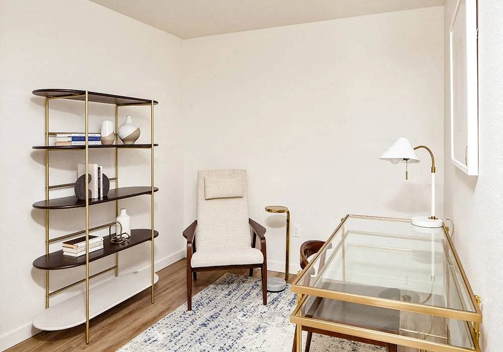 Den with desk and book shelf and lounge chair