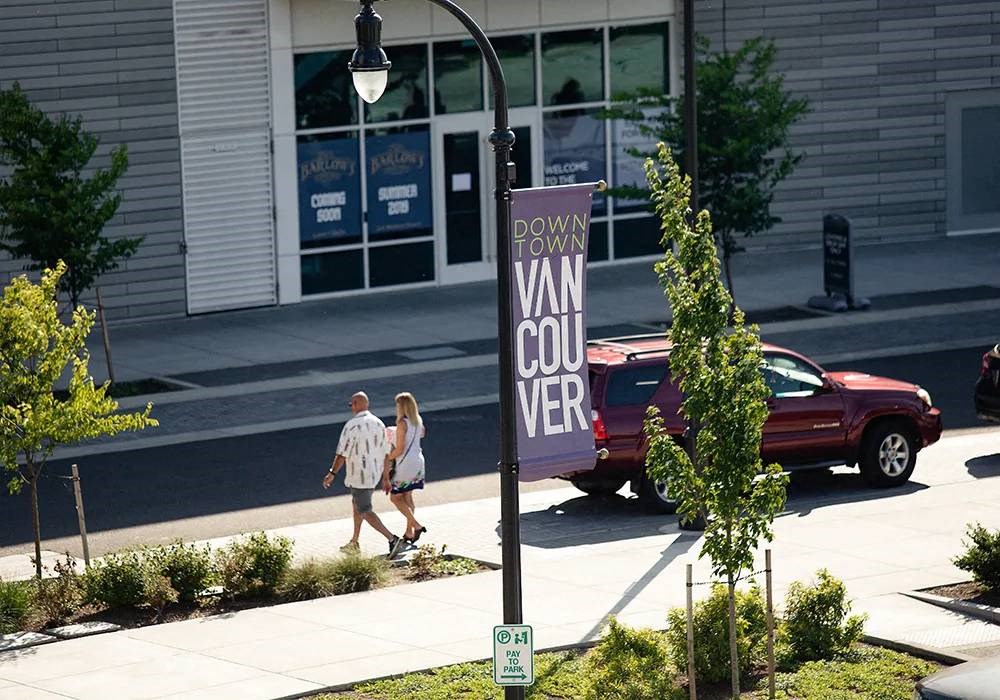 Couple walking on boardwalk on Waterfront Way