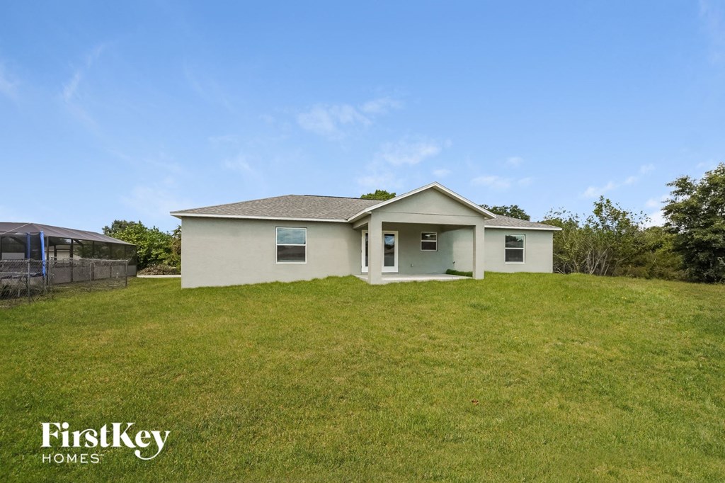 a house on a hill with a grass covered yard