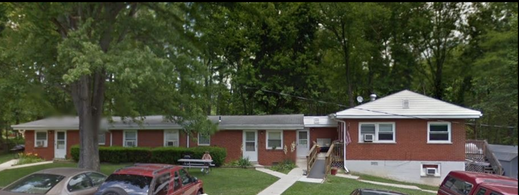 a house with cars parked in front of it