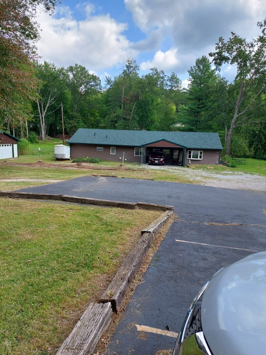 a view of a house from a parking lot