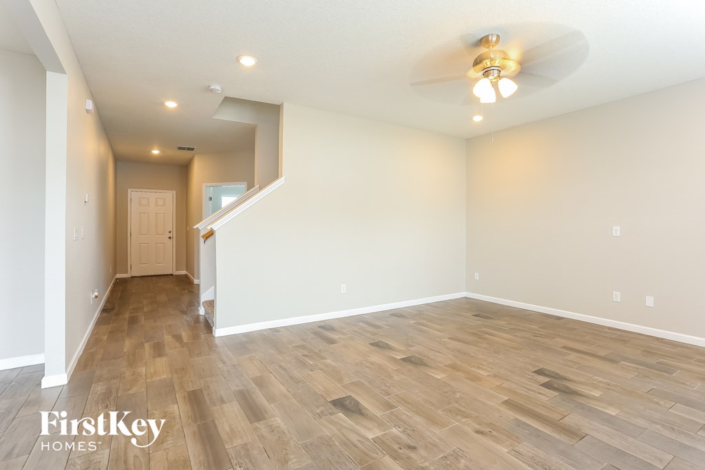 the living room is open to the dining room and kitchen