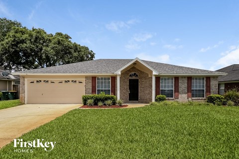 a house with a lawn in front of it
