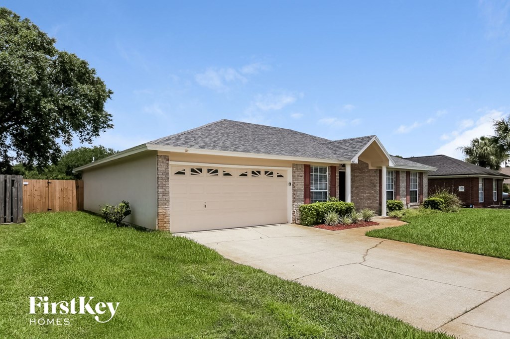 a house with a driveway and a garage door