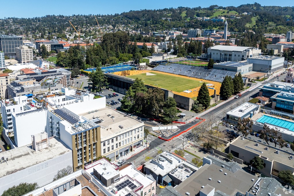 an aerial view of the city of culver city with a soccer field and buildings