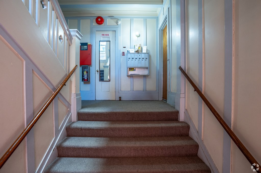 the stairs in a hospital room with a door to the bathroom