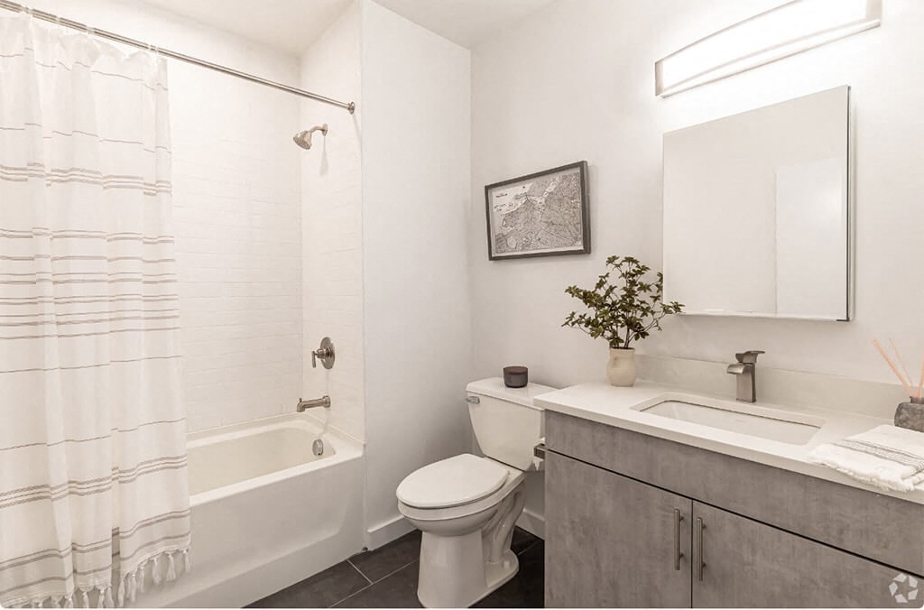 a bathroom with a sink toilet and a shower