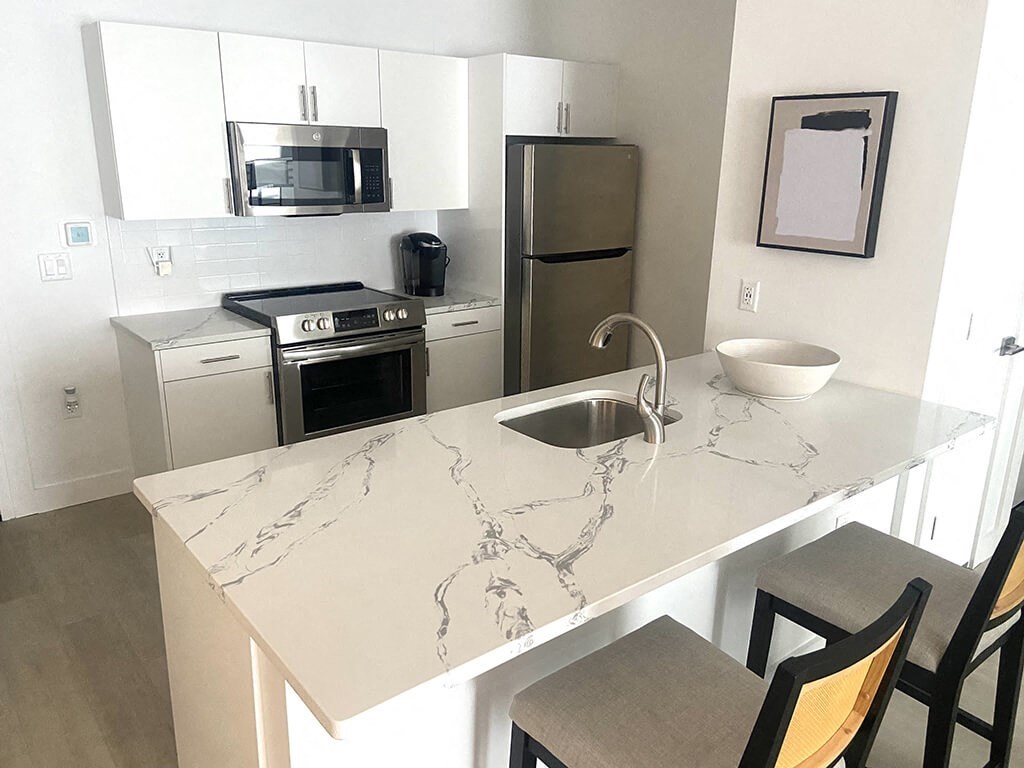 a kitchen with a counter top and a sink