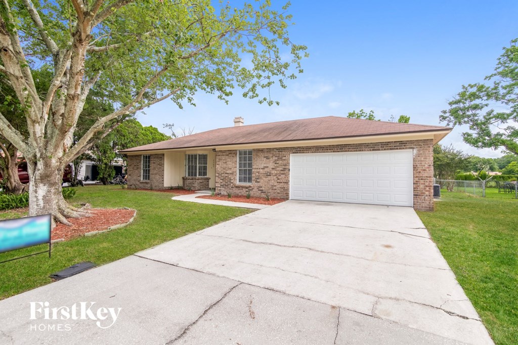 A house with a garage is for sale by FirstKey Homes.