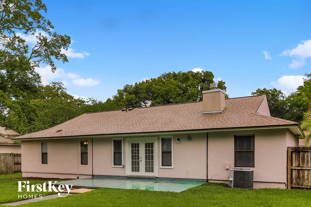 an old house with a pool in front of it