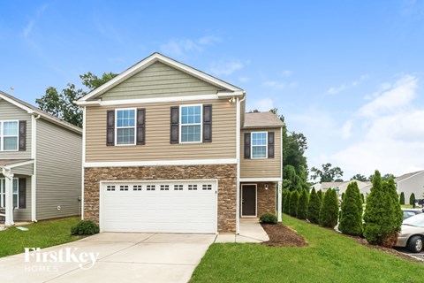 A house with a garage is for sale by FirstKey Homes.
