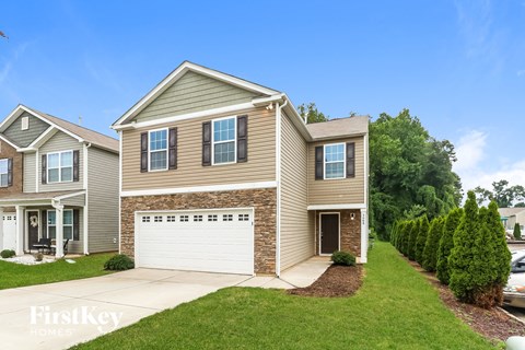 A house with a garage is for sale by FirstKey Homes.