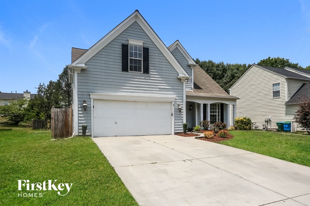a blue house with a white garage door
