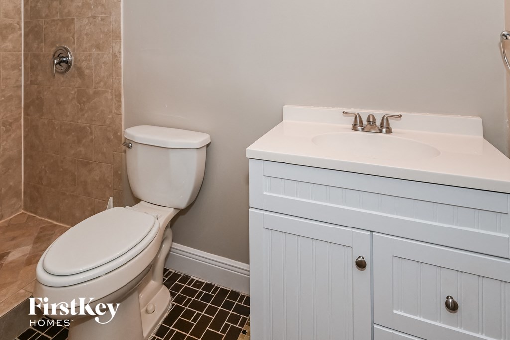 a bathroom with a toilet and a sink