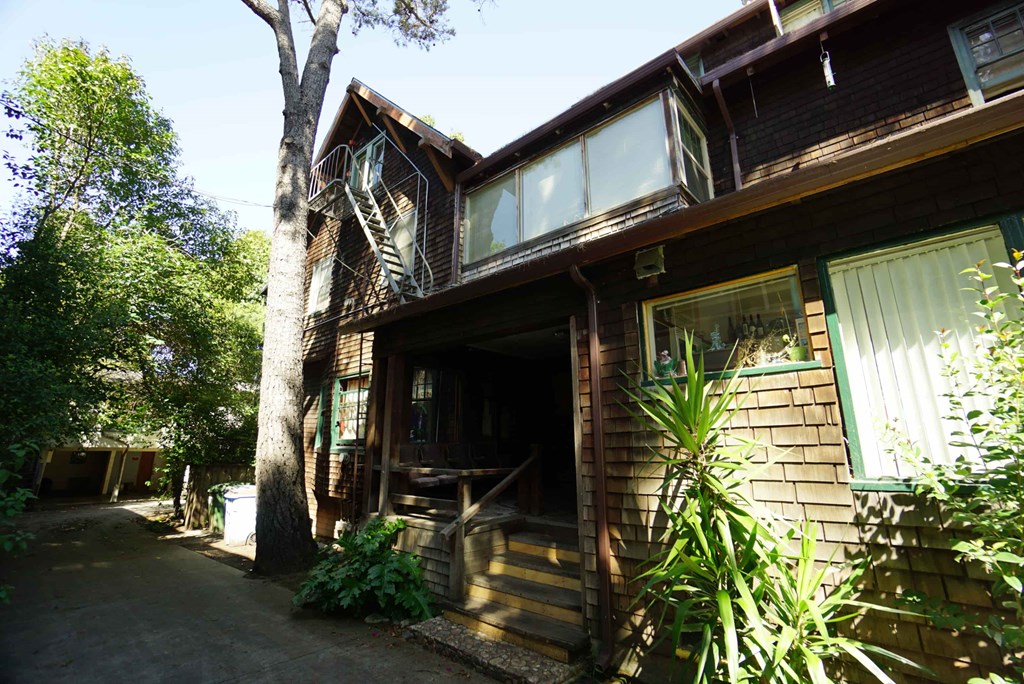 the front of the house with the garage door open