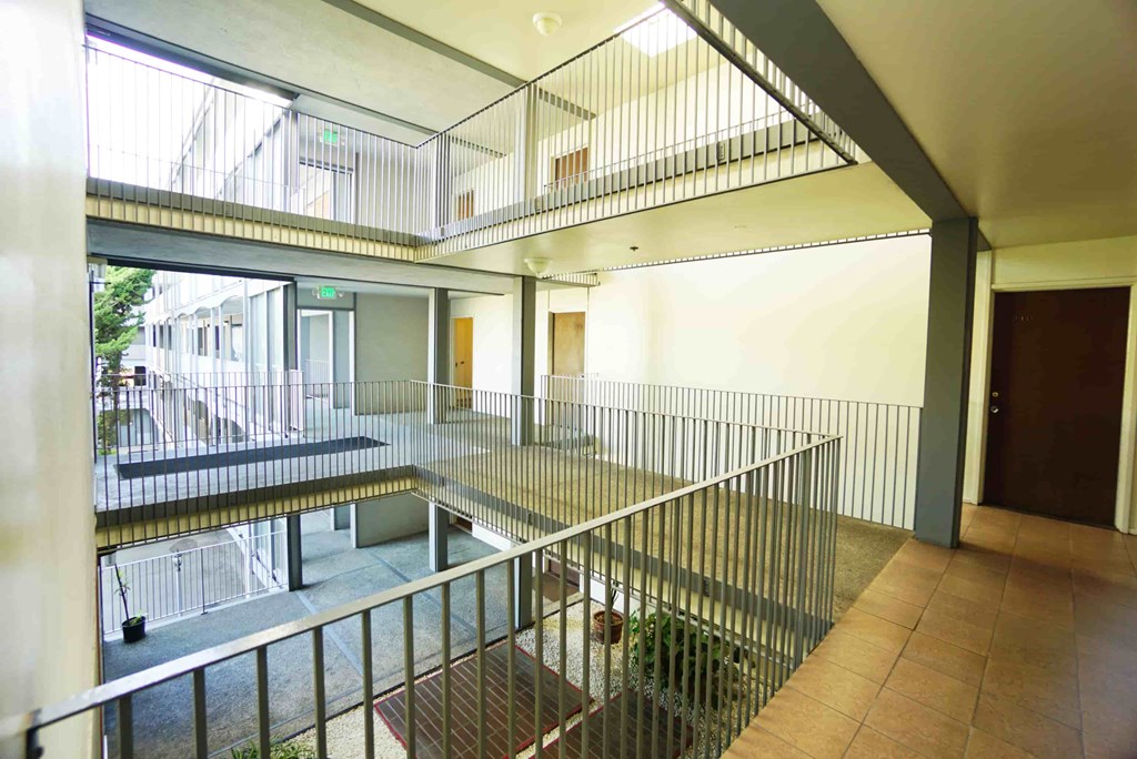 a view of arium with metal railing in a building