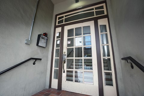 the entrance to a building with a glass door