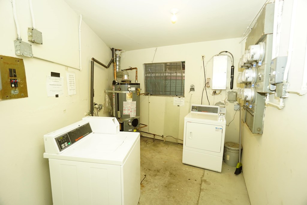 a small room with two washing machines in it