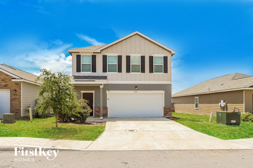 a house with a white garage door in front of it