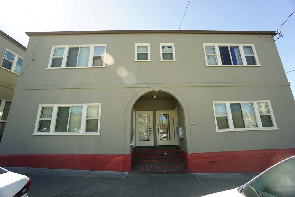 the front of a building with doors and windows