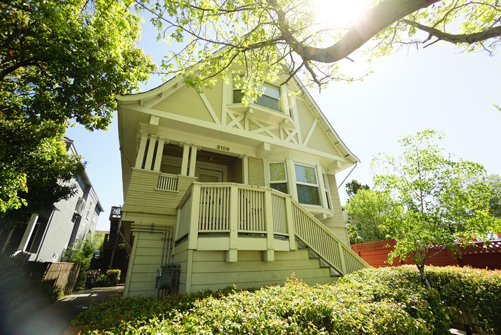 a white house with a porch and a