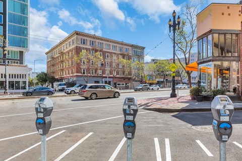 A parking lot with a row of parking meters.