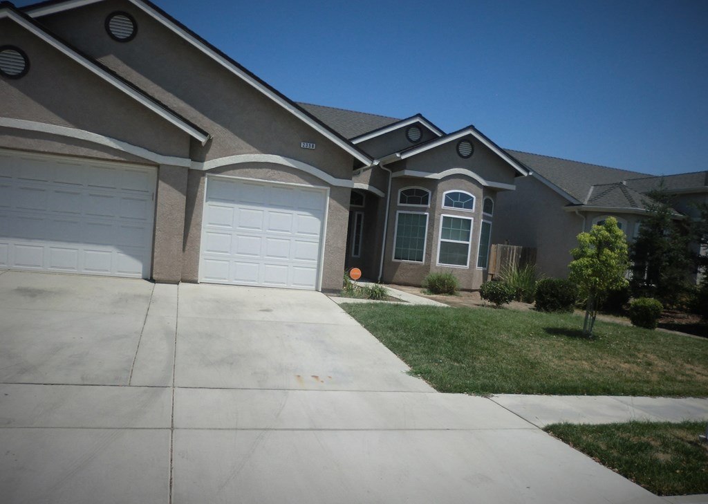 a house with a driveway and a garage door