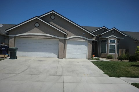 a house with a driveway and a garage door