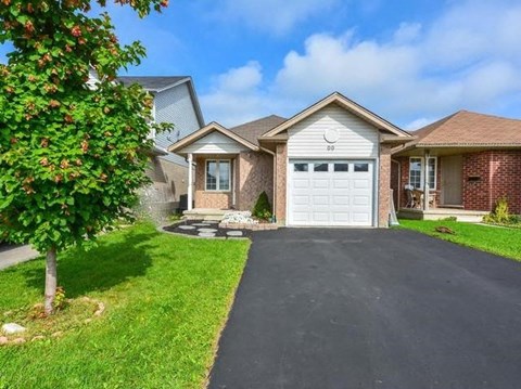 a house with a driveway and a white garage door