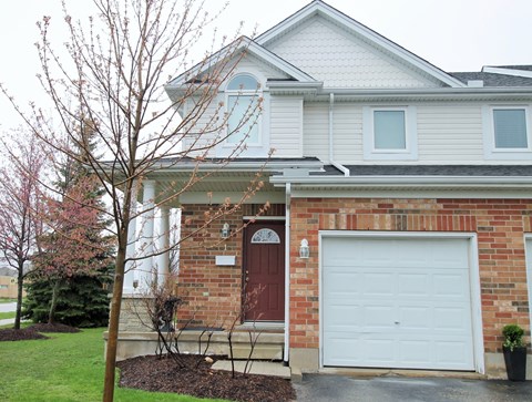 a brick house with a white garage door