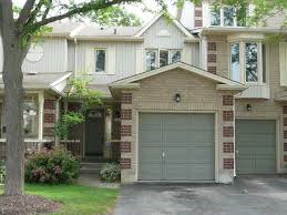 a house with a garage door in front of it