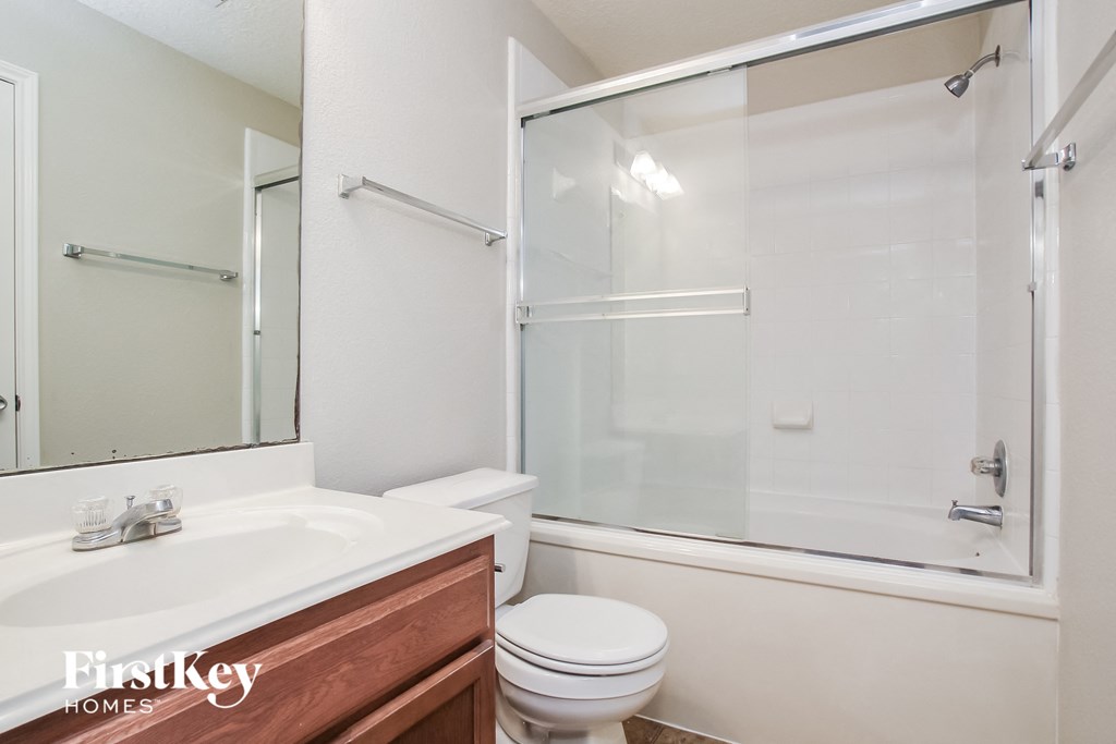a bathroom with a sink toilet and a shower