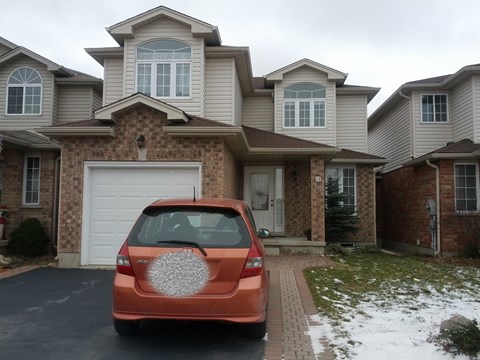 a car parked in front of a house