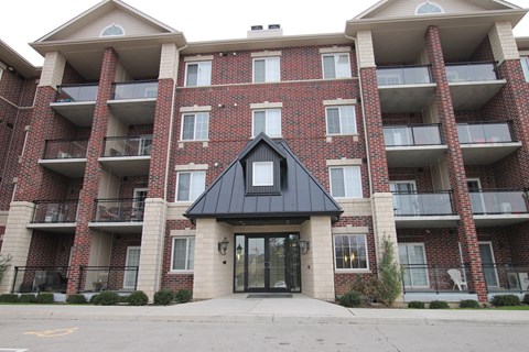 A red brick building with a black entrance.