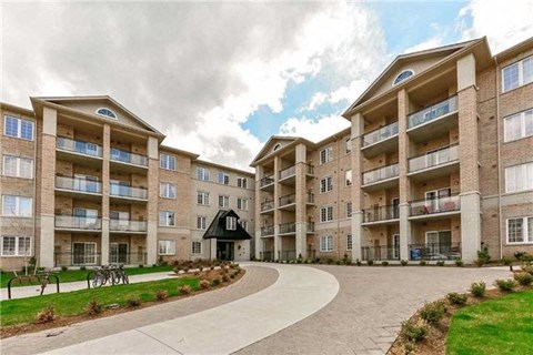 A large apartment complex with a black building in the center.