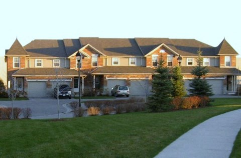 a large house with a driveway in front of it