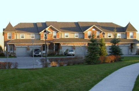 a large house with a driveway in front of it