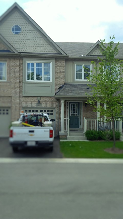 a police car parked in front of a house