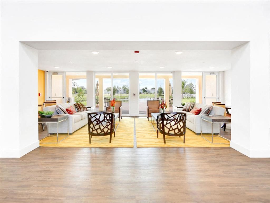 the living room is open to the dining room and kitchen