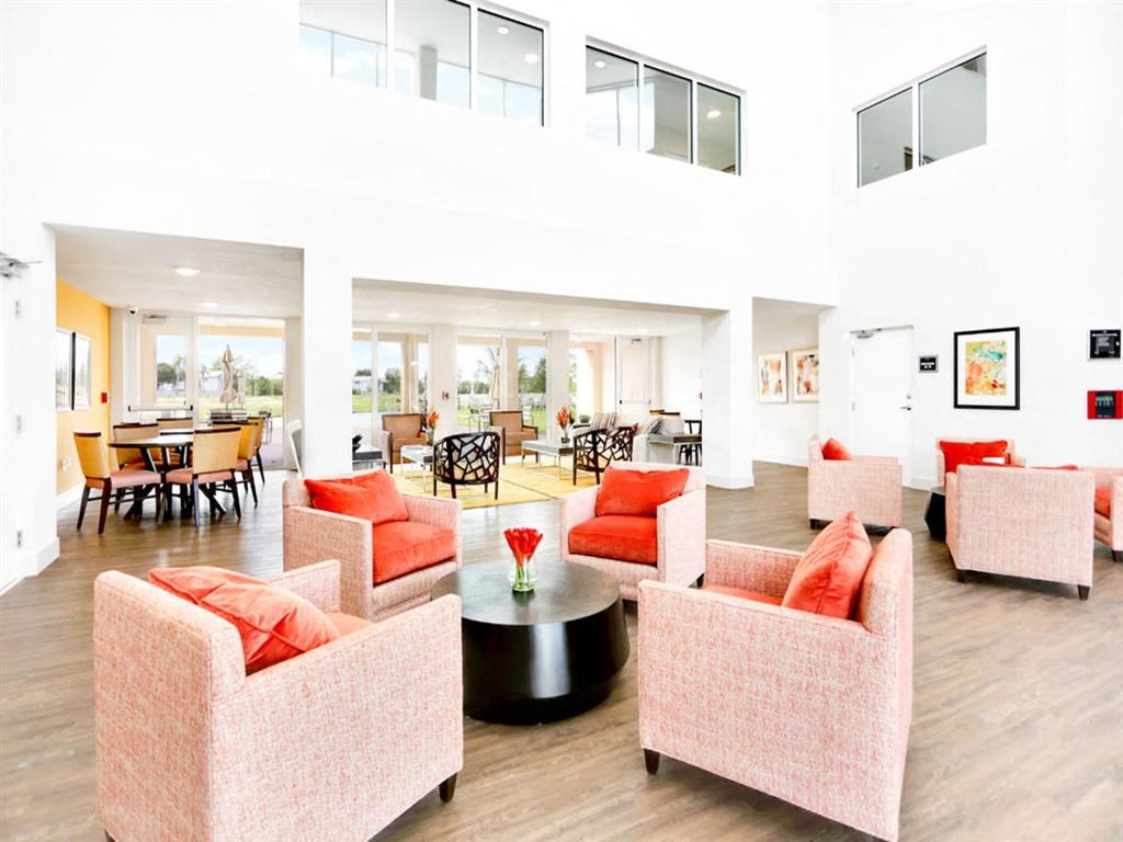 a living room with couches and chairs and a table